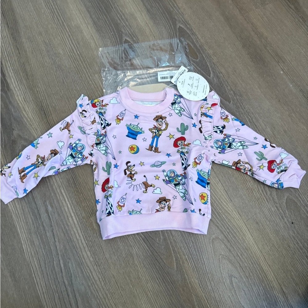 New little sleepies x Pixar Toy Story Stars Flutter Crewneck